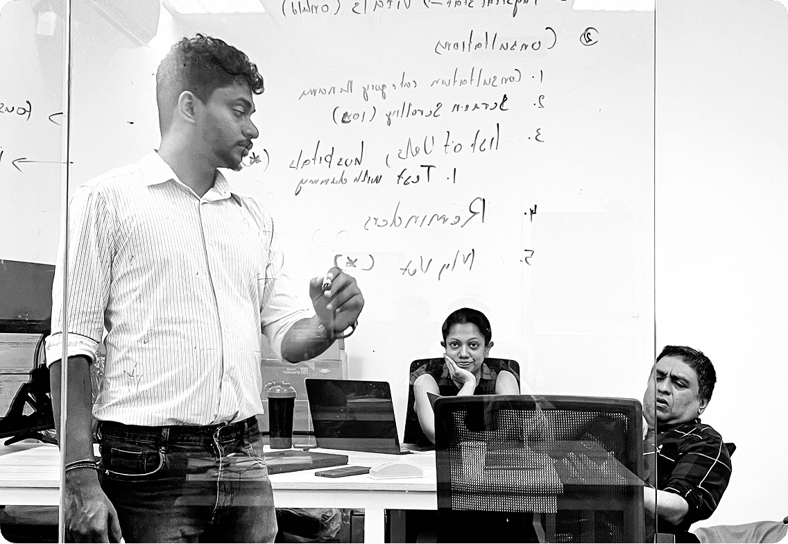 Upview team meeting at whiteboard