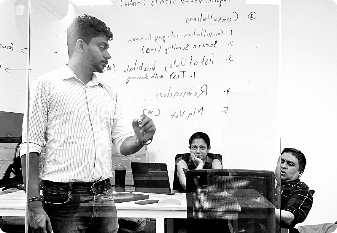 Upview team meeting at whiteboard