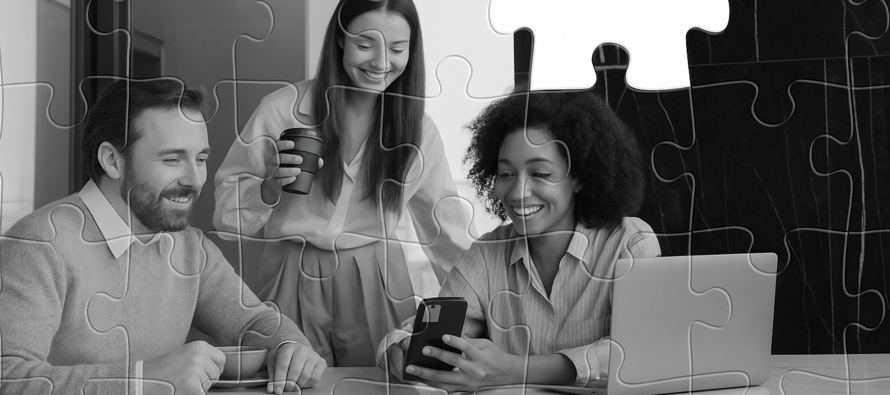 Team collaborating at a desk with puzzle-piece overlay